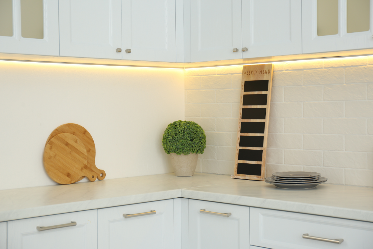 Under-cabinet lighting illuminating kitchen countertop workspace