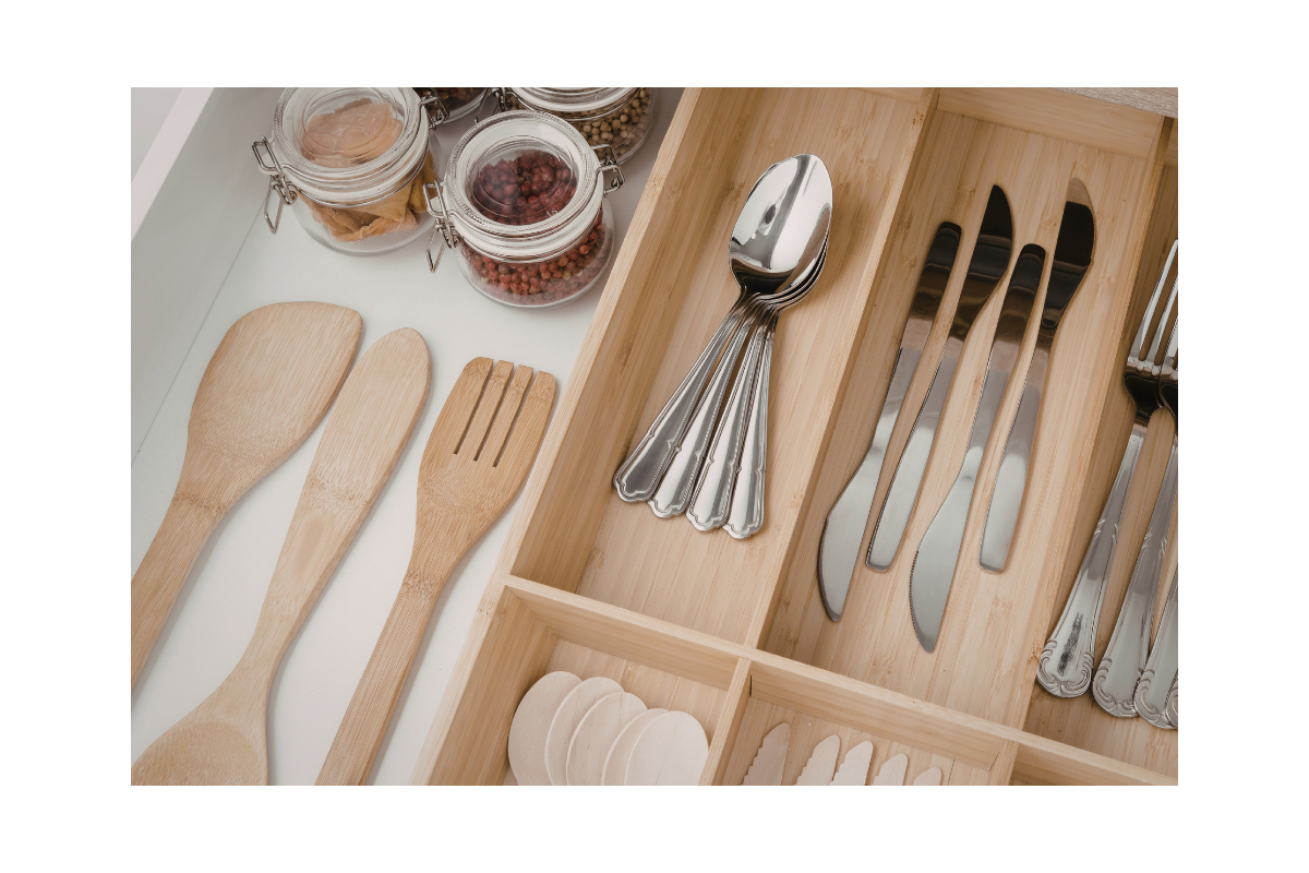 Organized kitchen drawer with pull-out cabinet storage