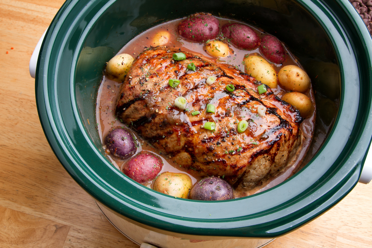 Slow cooker on a kitchen counter with condensation on the glass lid — best countertop appliances for easier cooking